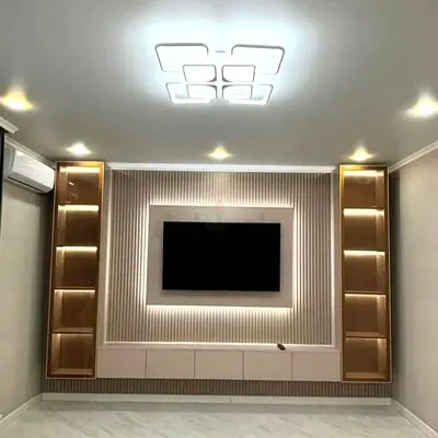 Modern built-in entertainment wall unit with LED shelving and TV mount