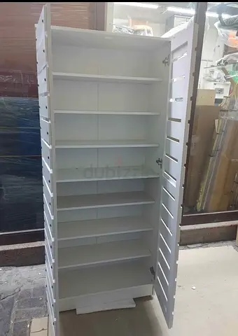 Tall white wooden cabinet with multiple adjustable shelves - good condition