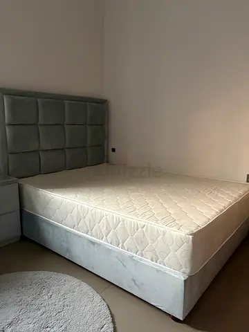 Blue Grey bed with mattress and matching bedside table. Two matching pillows and comforter free.