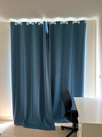 Blue blackout eyelet curtains - pair