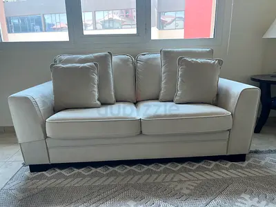 Light beige 2 & 3 seater sofa with footstall & cushions - excellent condition