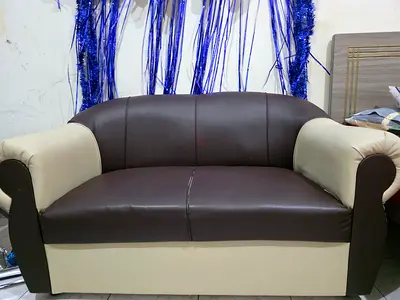 Three-seater and 2 single seater brown and beige faux leather sofa - good condition