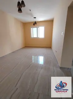 Second-occupancy 2BR in Al Nad, modern tower, central AC & parking included. AED 42K, 4/6 payments.