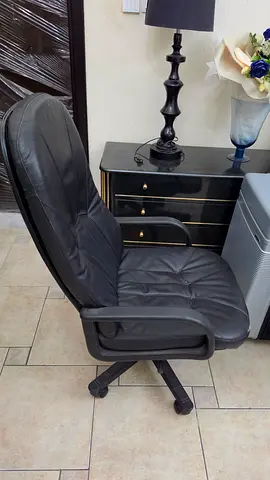 Black leather swivel office chair with armrests