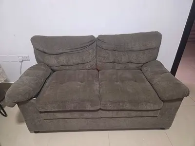 2-seater grayish brown fabric sofa in good condition