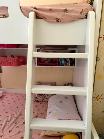 White wooden bunk bed with built-in shelves — good condition