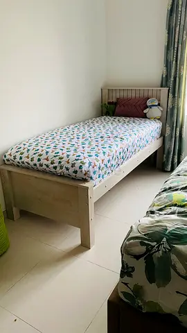 Single wooden bed without mattress in good condition