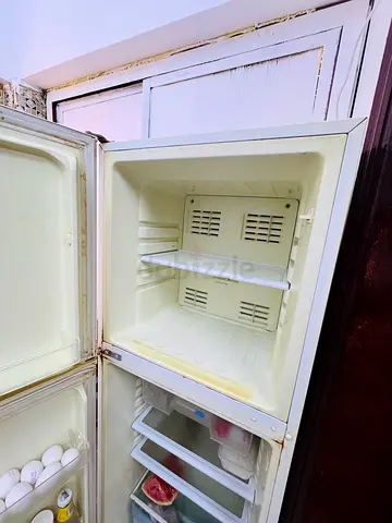 Used double-door refrigerator with freezer compartment - working condition