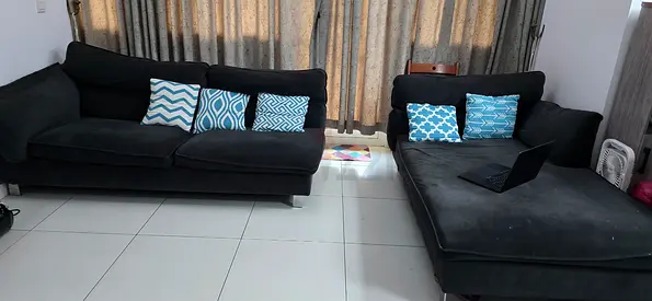 Black L-shaped sofa with chaise, good condition