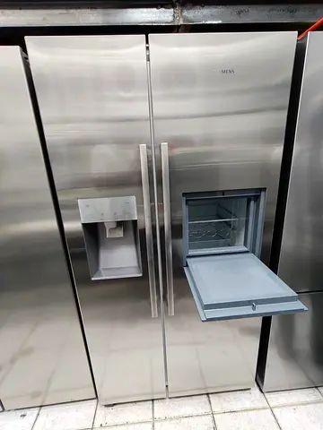 Siemens latest model iq700 side by side refrigerator with water depanser and ice maker with mini bar