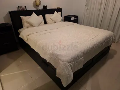 Queen size dark wood bed frame with storage and headboard - good condition