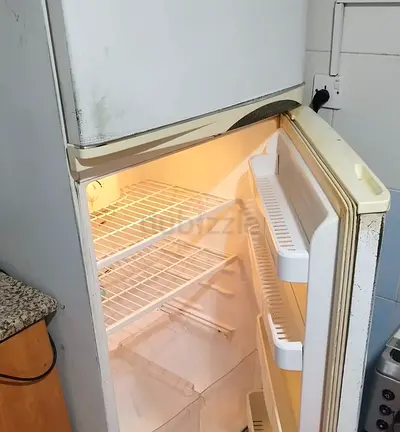 Urgent Sale: Used refrigerator with freezer compartment - working condition