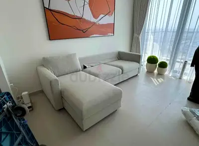L-shaped fabric sofa bed with chaise — gently used