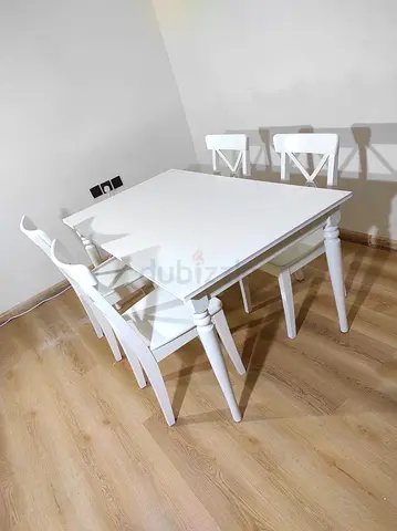 IKEA extendable dining table with 4 chairs for sale