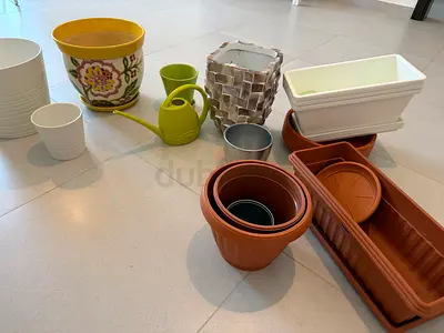 Mixed assortment of plant pots and planters - various sizes, great condition, all aed 125