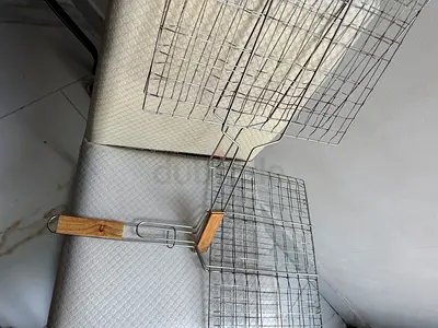 Pair of stainless steel grilling baskets with wooden handles - used