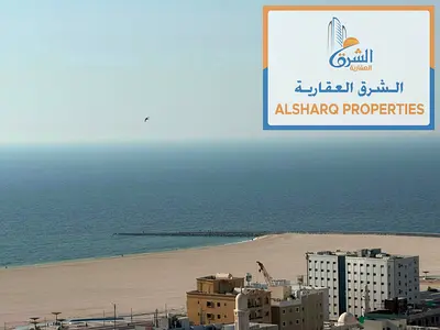 A fully furnished one-bedroom apartment with new furniture, two bathrooms, and a balcony with a direct view of the Corniche.