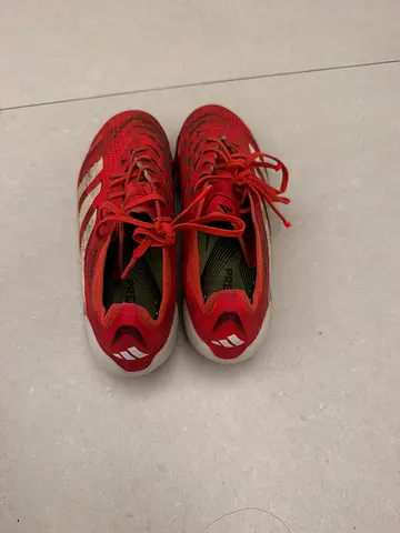 Used red Adidas running shoes, size not labeled (good condition)