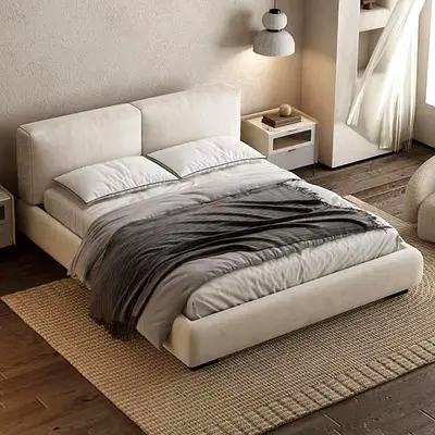 Low-profile upholstered double bed with padded headboard - cream
