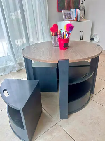 Round wooden kitchen island with two matching stools - compact
