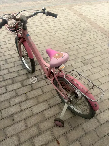Pink kids bicycle with basket – good condition