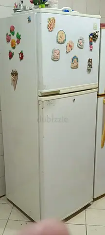 white refrigerator with top-freezer– good working condition
