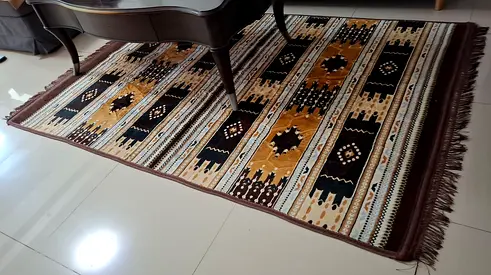 Patterned Area Rug with Geometric Design and Fringes
