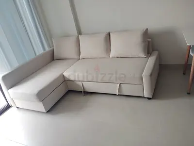 Beige L-shaped Sofa with Storage - Good Condition