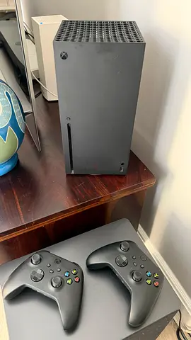Xbox Series X console with two wireless controllers
