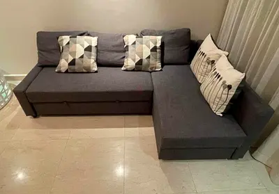 Gray L-shaped Sofa Bed with Storage - Good Condition