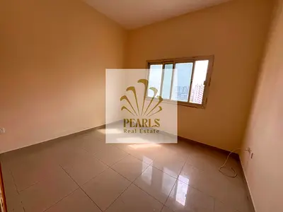 2BR for annual rent in Al Nuaimiya 1, behind Casa Cafe, with 2 bathrooms and central AC, suitable for sharing or staff accommodation.