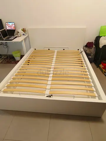White wooden double bed frame with slatted base, good condition