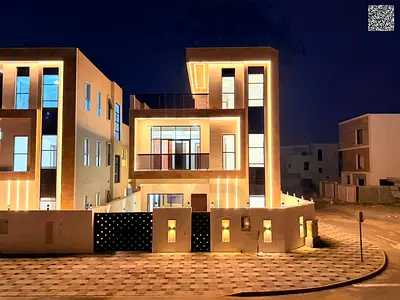 Luxury corner villa for sale in Al Bahia, comprising 3 floors, with a private pool and 5 master bedrooms, featuring a modern design and spacious layou