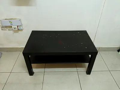 Simple black coffee table with lower shelf — used, good for living room