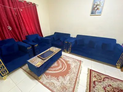 Blue velvet 3-seater sofa + 2 armchairs and ottoman set - good condition