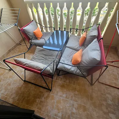 4-piece outdoor balcony sofa set with cushions and coffee table