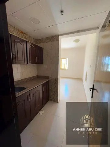 Annual studio for rent in Ajman with a separate kitchen, excellent space, modern finishes, natural