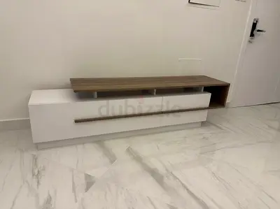 Modern low-profile TV cabinet with wood top and white drawers