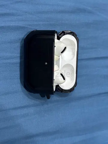 Apple AirPods Pro (1st gen) with sturdy black spine protective case.