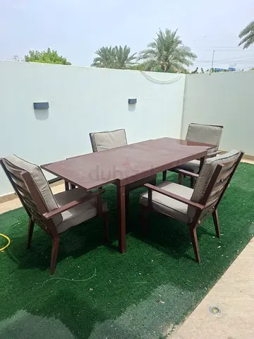 Folding table with lock and 4 chairs with cushions