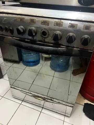 Used freestanding gas oven with mirrored front - needs cleaning/repair
