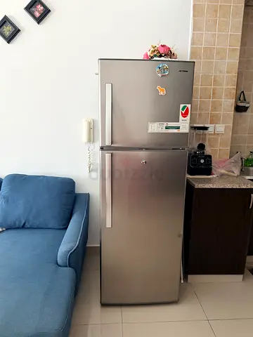 Used stainless steel double-door refrigerator in good condition