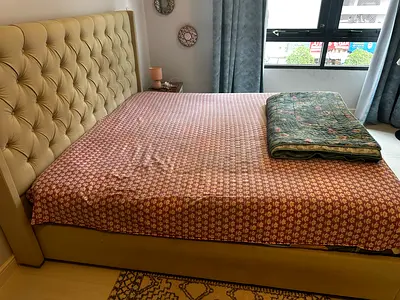 Queen upholstered bed with tufted headboard and storage - beige color