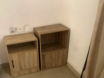 Pair of light oak bedside cabinets with storage cupboard