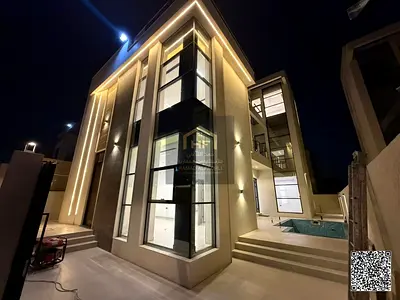 Luxury Modern Living: 2 Brand-New Modern Villas with Private Swimming Pool & Rooftop Terrace for Sale in Al Yasmeen (Al Meedan), Ajman – Stone Facade