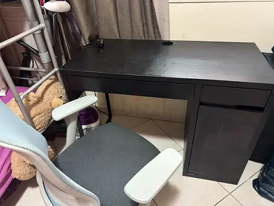Used black writing desk with storage cabinet and office chair