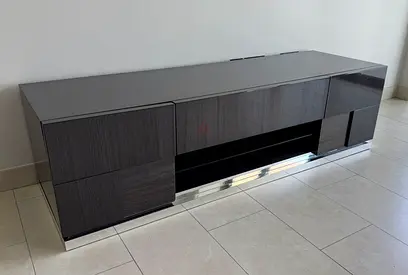 Dark wood low TV cabinet