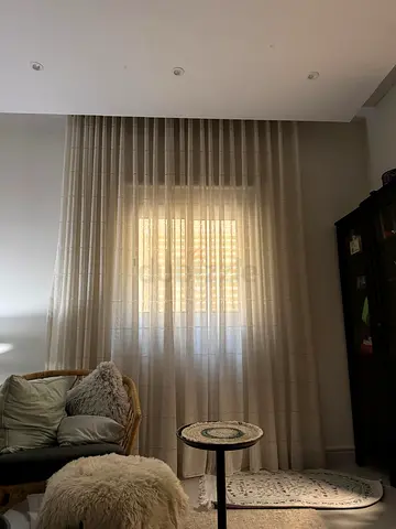 Sheer beige floor-to-ceiling curtains (pair) without rod