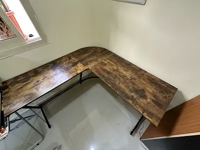 L-shaped corner office desk with wood finish and metal legs