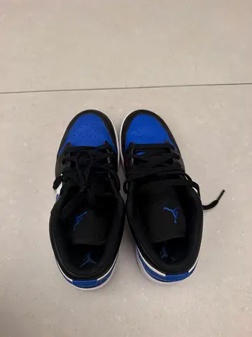 Pair of black & blue Jordan sneakers, gently used, size appears youth/adult small